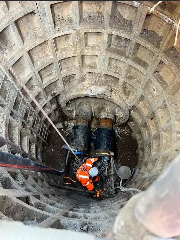 Image of people installing carbon lining