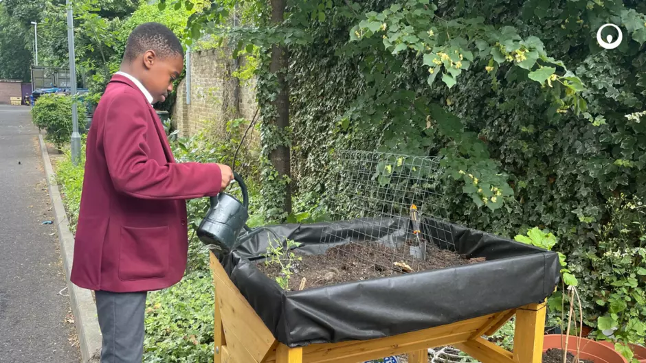 Child with watering can