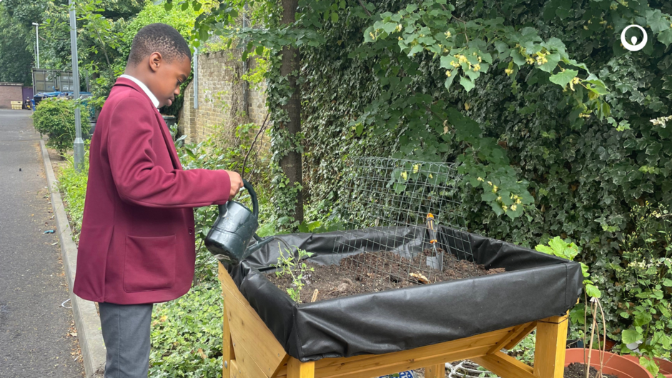Child with watering can
